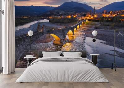 Aerial view of Bobbio town and Bridge of Devil at sunset. Emilia Romagna, Italy Wall mural