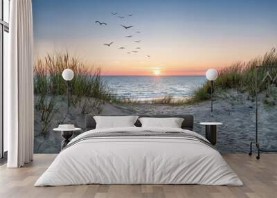 Sand dunes on the beach at sunset Wall mural