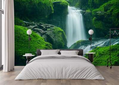 Waterfall in a green forest with rocks and green moss Wall mural