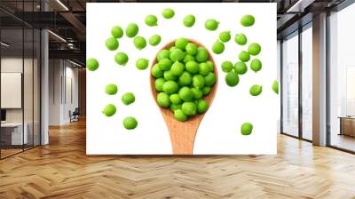 fresh green peas in a wooden spoon isolated on a white background. top view Wall mural