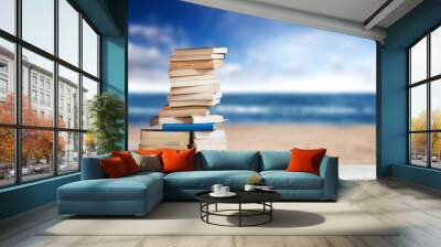 Stack of Travel Guides before a empty Beach Wall mural