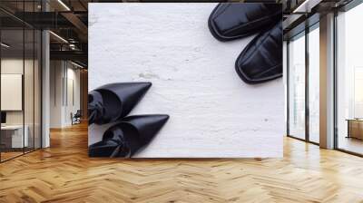 Beautiful black female and male shoes on grunge white wood Floor. View from above with copy space. Wall mural