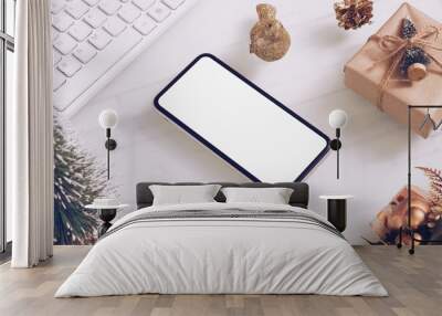 Mockup blank white screen smartphone on home office desk  for Christmas and New Year party background concept, Flat lay top view with copy space for your Merry Christmas and Happy New year artwork. Wall mural