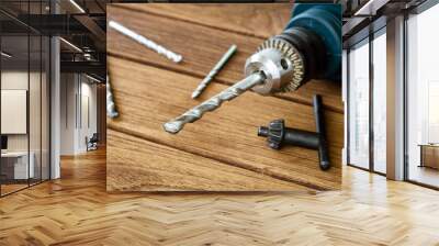 power drill closeup on wooden background Wall mural