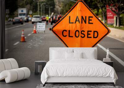 lane closed orange diamond shaped sign with work crew in distance Wall mural