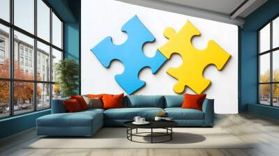 Two colored puzzle pieces connecting on a white background, symbolizing collaboration and connection in educational planning for special needs students, emphasizing inclusivity and teamwork Wall mural