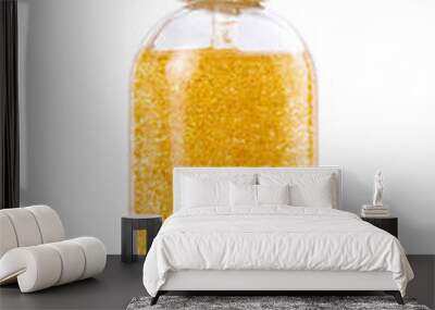 Golden serum in glass bottle isolated on white background Wall mural