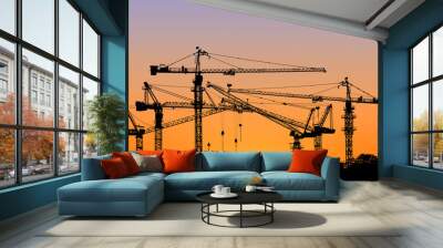 silhouette of construction tower crane with sunset sky backgroun Wall mural