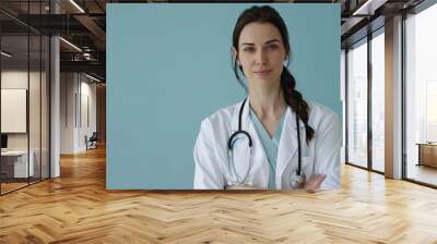 medical concept of young female doctor in white coat with stethoscope Wall mural