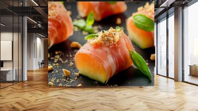 Prosciutto e melone: small portions of melon wrapped in prosciutto, presented with basil leaves and peanut crumb on a black background
 Wall mural