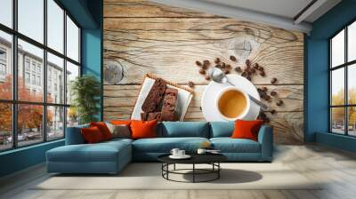 Espresso cup, biscuits and coffee beans on wooden background, top view, space for text. Wall mural