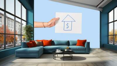 Hand holds house mortgage concept poster. Isolated. Wall mural