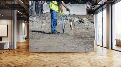 How to trace power cables with the cable Finder. Electric technical worker with power cable fault location carries out a work of tracing the new electric line with a colored spray can. Wall mural