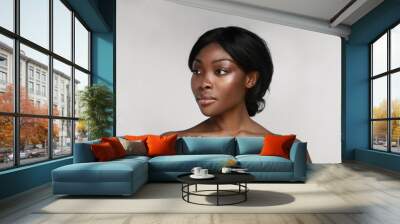 African american woman with clean healthy skin looking aside, isolated. Wall mural