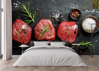 top view red raw meat and salt and oil on black wooden background Wall mural