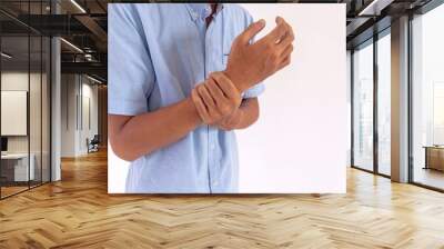 Man holding his wrist due to arthritis or carpal tunnel syndrome Wall mural