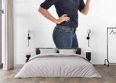 full length portrait of air wearing blue shirt and denim pants, standing pose on white background. Wall mural