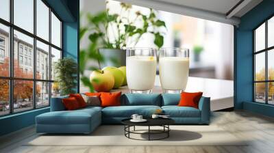 Apple smoothie in two glasses in white modern kitchen with green apples, healthy breakfast or snack idea Wall mural