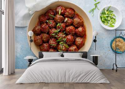 asian meatballs with sweet and sour sauce in a pan Wall mural