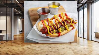 Classic american beef hot dog topped with ketchup, mustard, relish and onion Wall mural