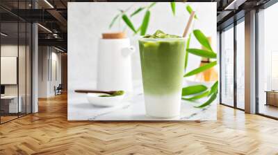 Cold matcha latte in a tall glass on marble Wall mural