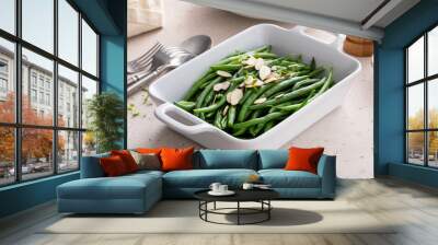 Green beans topped with almonds in a baking dish, traditional side dish for dinner or celebration Wall mural