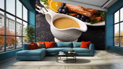 Homemade gravy in a sauce dish with turkey Wall mural