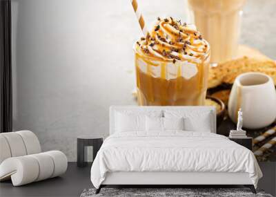 Iced caramel latte coffee in a tall glass Wall mural