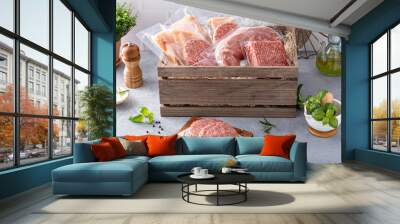 Meat delivery box, variety of meat chops and packages in a wooden crate Wall mural