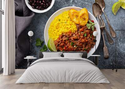 Ropa vieja, traditional flank steak dish with rice, cuban beans and plantains Wall mural