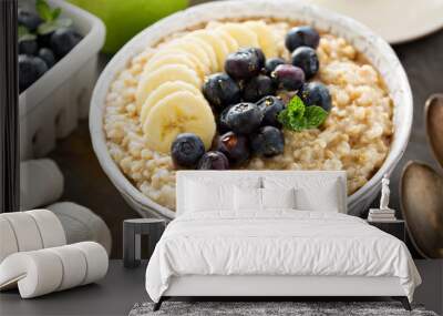 Steel cut oatmeal porridge with banana and blueberry Wall mural