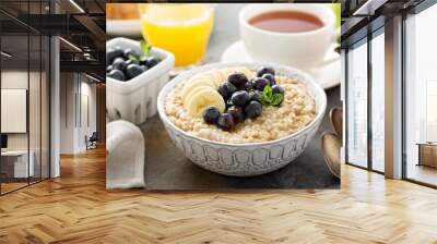 Steel cut oatmeal porridge with banana and blueberry Wall mural