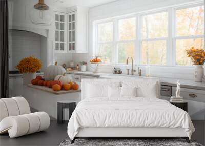 White modern kitchen decorated for fall with orange pumpkins and leaves, generative AI Wall mural