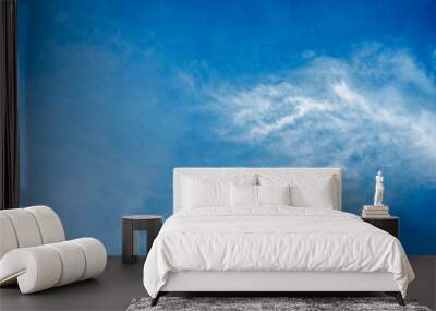 Wallpaper of White clouds on blue sky with copy space for banner background Wall mural