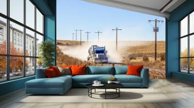 Dust raised by a heavy truck on a dirt road in Northeastern Colorado, USA Wall mural