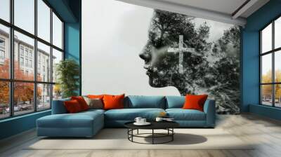 Double exposure of a woman with a cross and trees on her head. Monochrome image. Wall mural