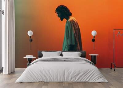 Portrait of Jesus Christ on orange background. Wall mural