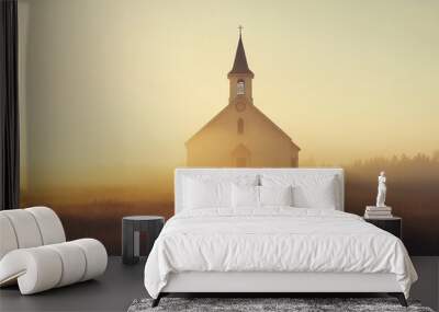 Small church in a misty meadow at sunrise, panorama. Wall mural