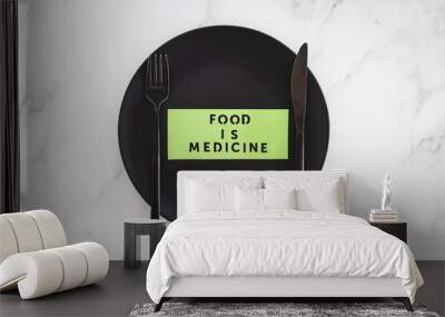 Food is Medicine text on dining plate with fork and knife, dieting vs healthy nutrition and intuitive eating. Wall mural