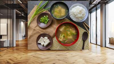 miso soup or Japanese miso soup in bowl on the table. Japanese cuisine in the form of soup with dashi ingredients, tofu, seafood, vegetables, and topped with miso to taste Wall mural