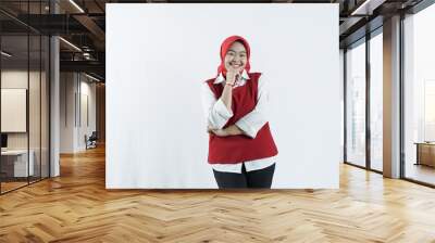 Asian woman in hijab looks happy in Indonesian independence day outfit woman's hand that shows an okay gesture Wall mural