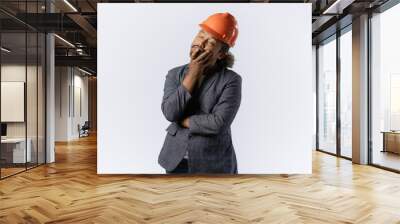 project leaders who look tired and pessimistic. stylish asian man with orange suit and helmet on white background. construction or mining business concept photo Wall mural