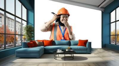 Young Asian female construction worker in hijab who looks very angry while on a voice call, industrial and construction concept, isolated white background. Wall mural