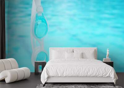 swimming goggles hang on the water Wall mural