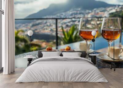 With a view of Funchal town, Madeira, Portugal, the cafe serves two glasses of Madeira wine, two cups of freshly made espresso coffee, and the traditional Portuguese honey and nut dessert Wall mural