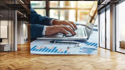 businessperson’s hands typing on a laptop Wall mural