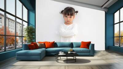 Angry little girl over white background, sign and gesture concept Wall mural