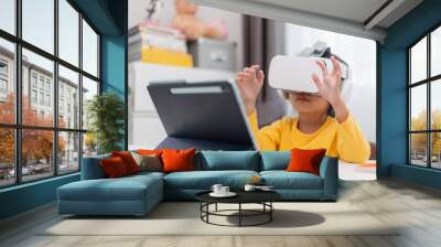 Asian Child with Virtual Reality, VR, Kid Exploring Digital Virtual World with VR Goggles. Wall mural