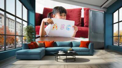 Asian girl student online learning class study online with laptop at home. Wall mural