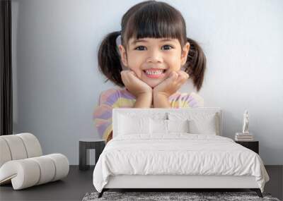 Portrait of happy smiling child girl isolated on white background Wall mural